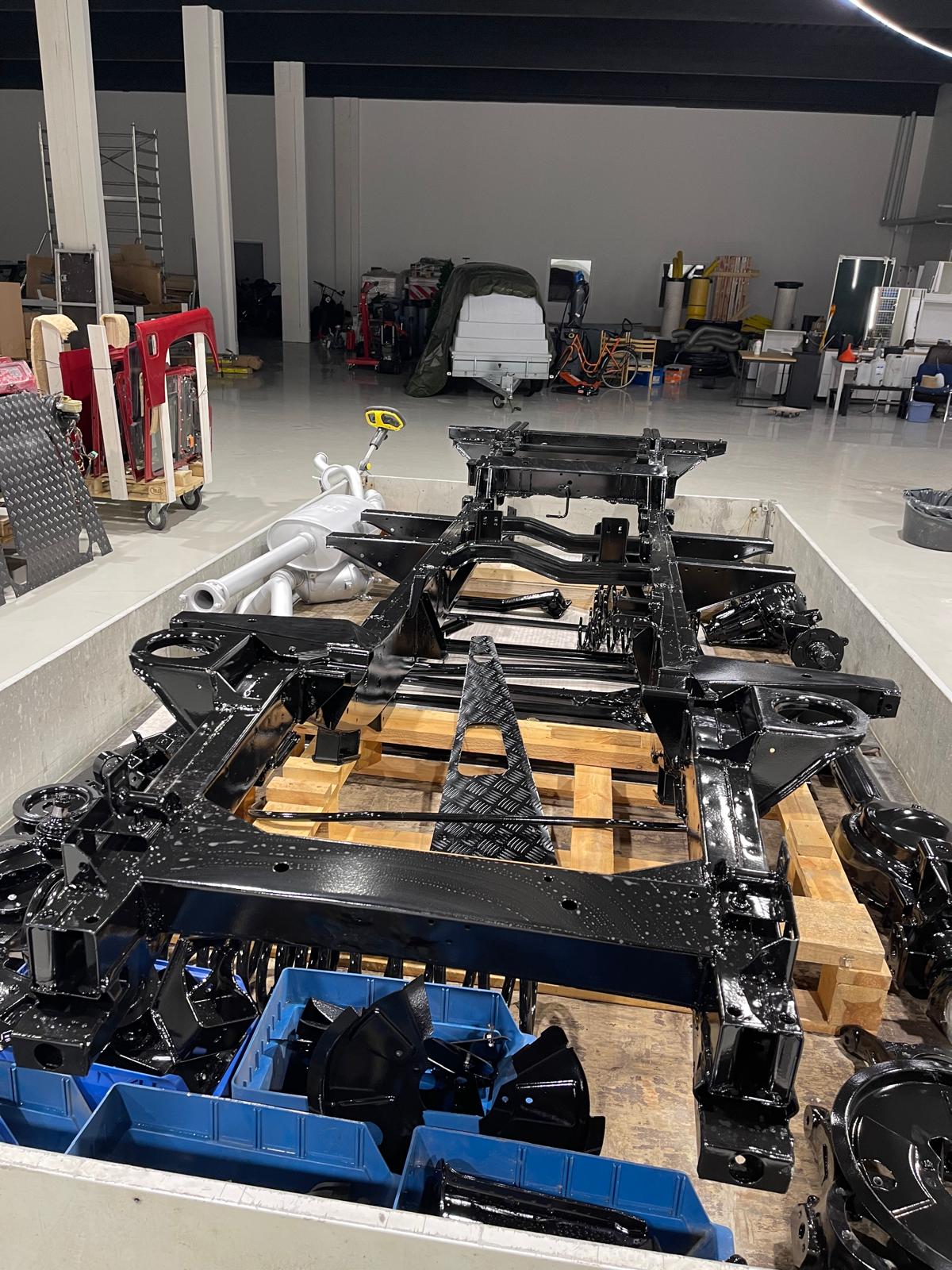 Multiple Defender chassis lined up — refurbishment program