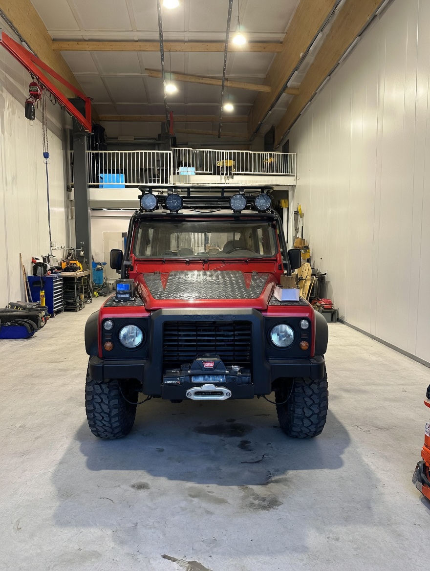 Defender 130 Spectre — finished, head-on in the workshop